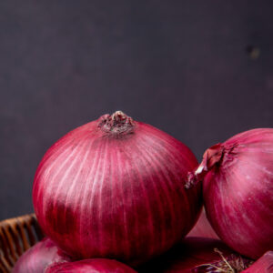 close-up-view-red-onions-maroon-background-with-copy-space